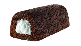 Hostess Twinkies creamy filling closeup, highlighting smooth texture for a quick treat.