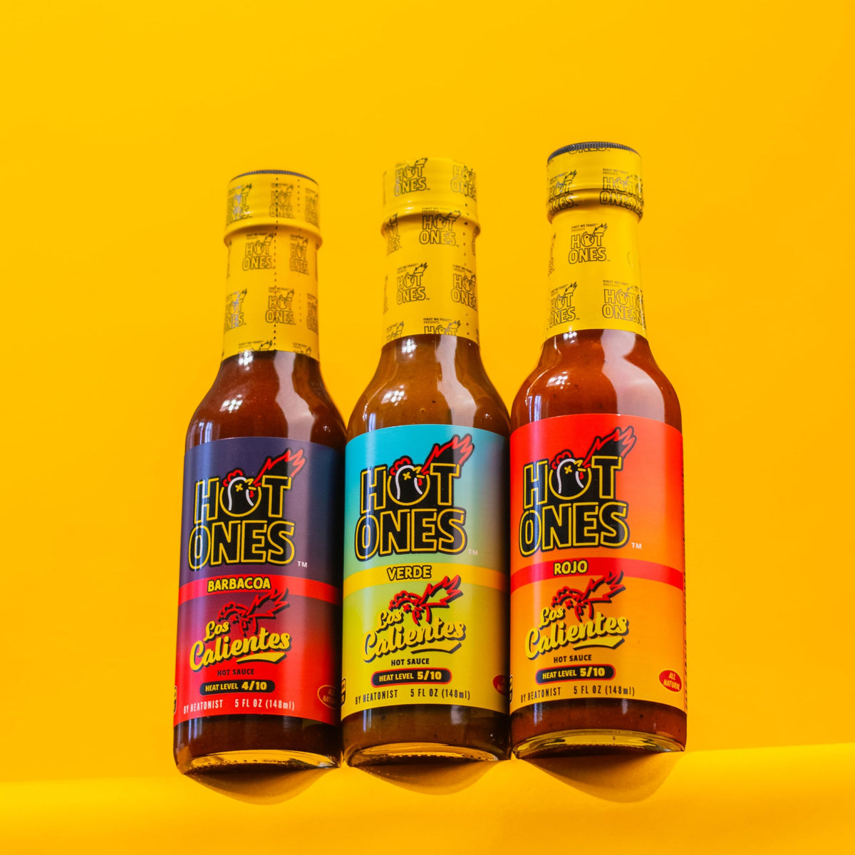 Hot Ones Caliente Trio ingredients closeup—natural fruits and chiles for real flavor.