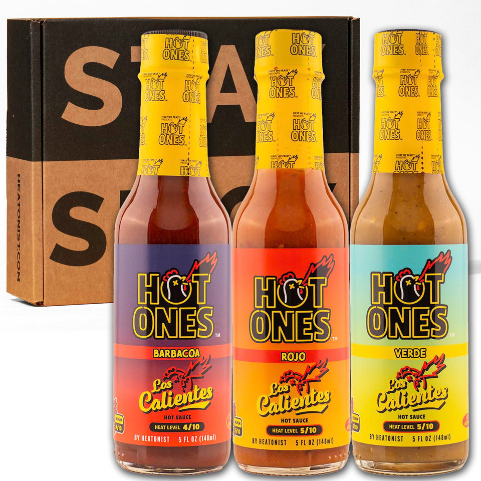 Hot Ones Caliente Trio Original bottle pour—bold flavor depth for grills and sauces.