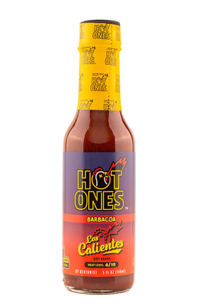 Hot Ones Los Calientes Barbacoa bottle being poured, enhancing grilled meats.