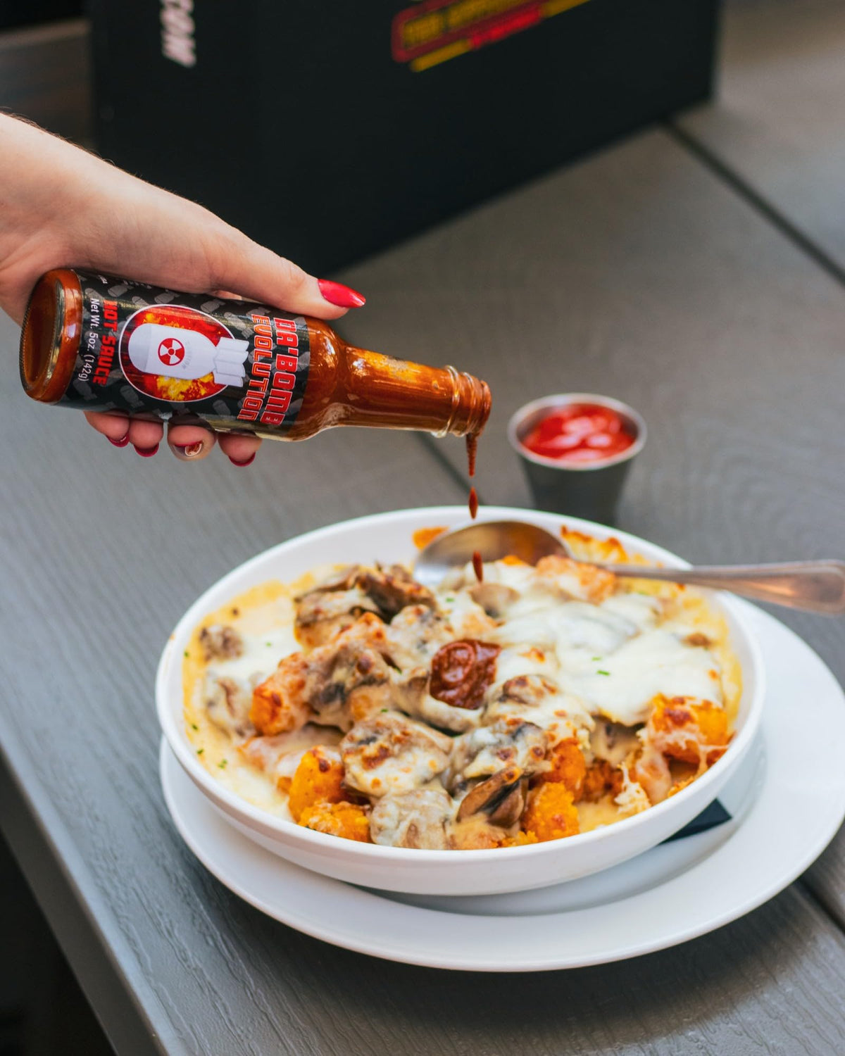 Hot Ones Passiflora Fire bottle pour adds bright tropical heat and fruity aroma