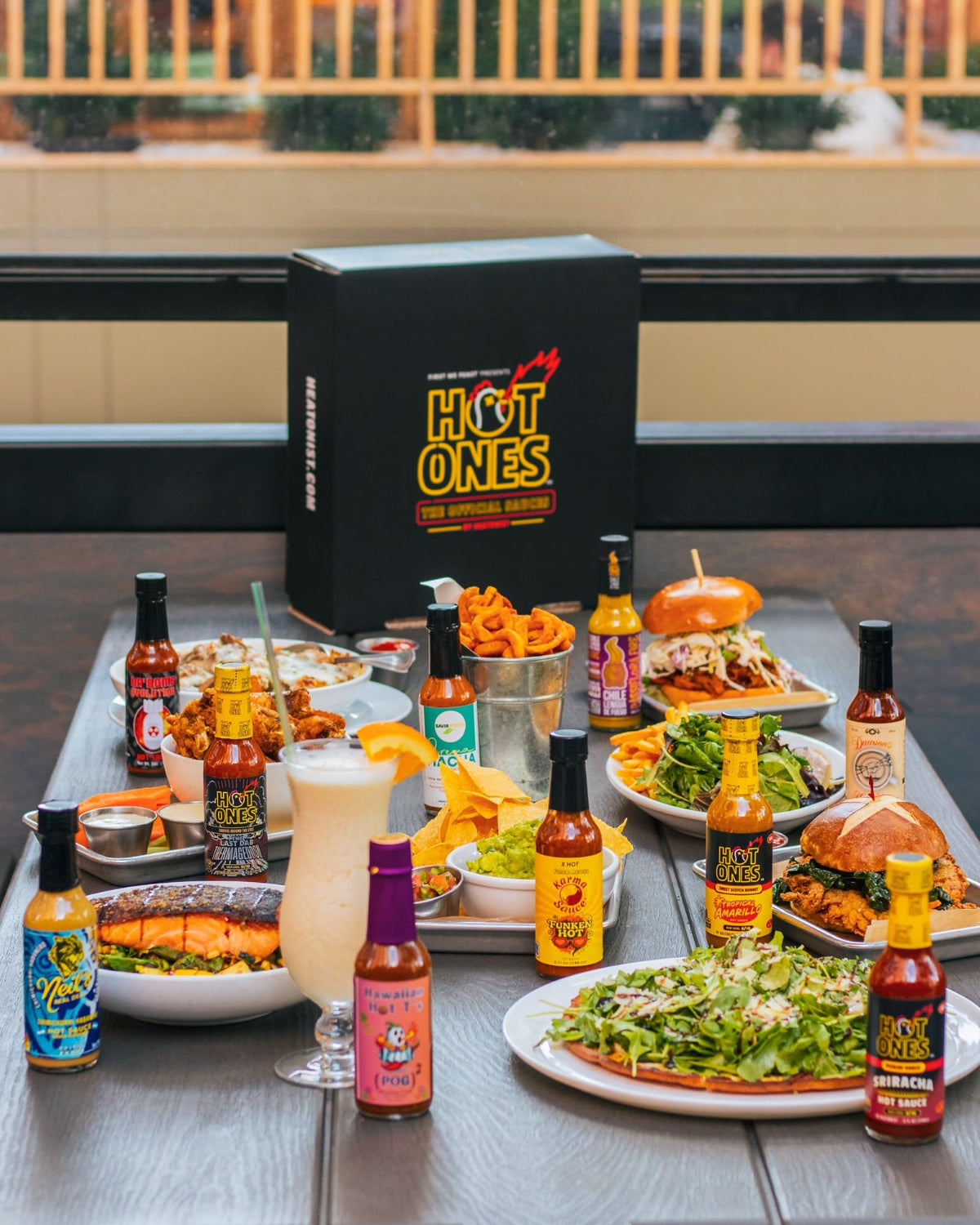Hot Ones Sriracha Pickled Garlic bottle pour boosts wings with bold tangy garlic heat