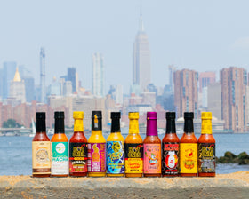 Hot Ones Tropical Amarillo bottle pour brings sunny citrus heat to bowls and tacos