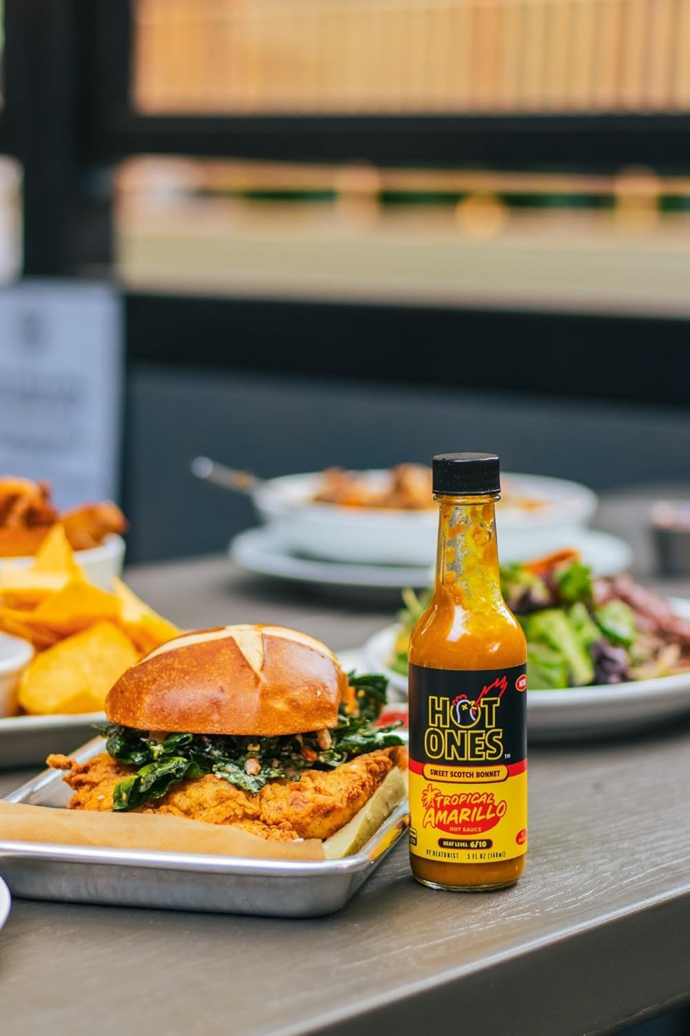 Hot Ones Season 29 pickled garlic sriracha bottle complements sandwiches