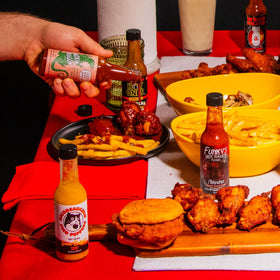 Hot Ones three bottle pour action demonstrates easy drizzles on food
