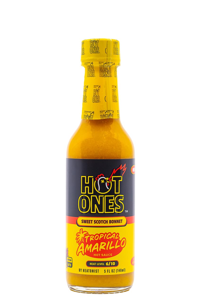 Hot Ones Tropical Amarillo Hot Sauce bottle with vibrant label—great for grilling.