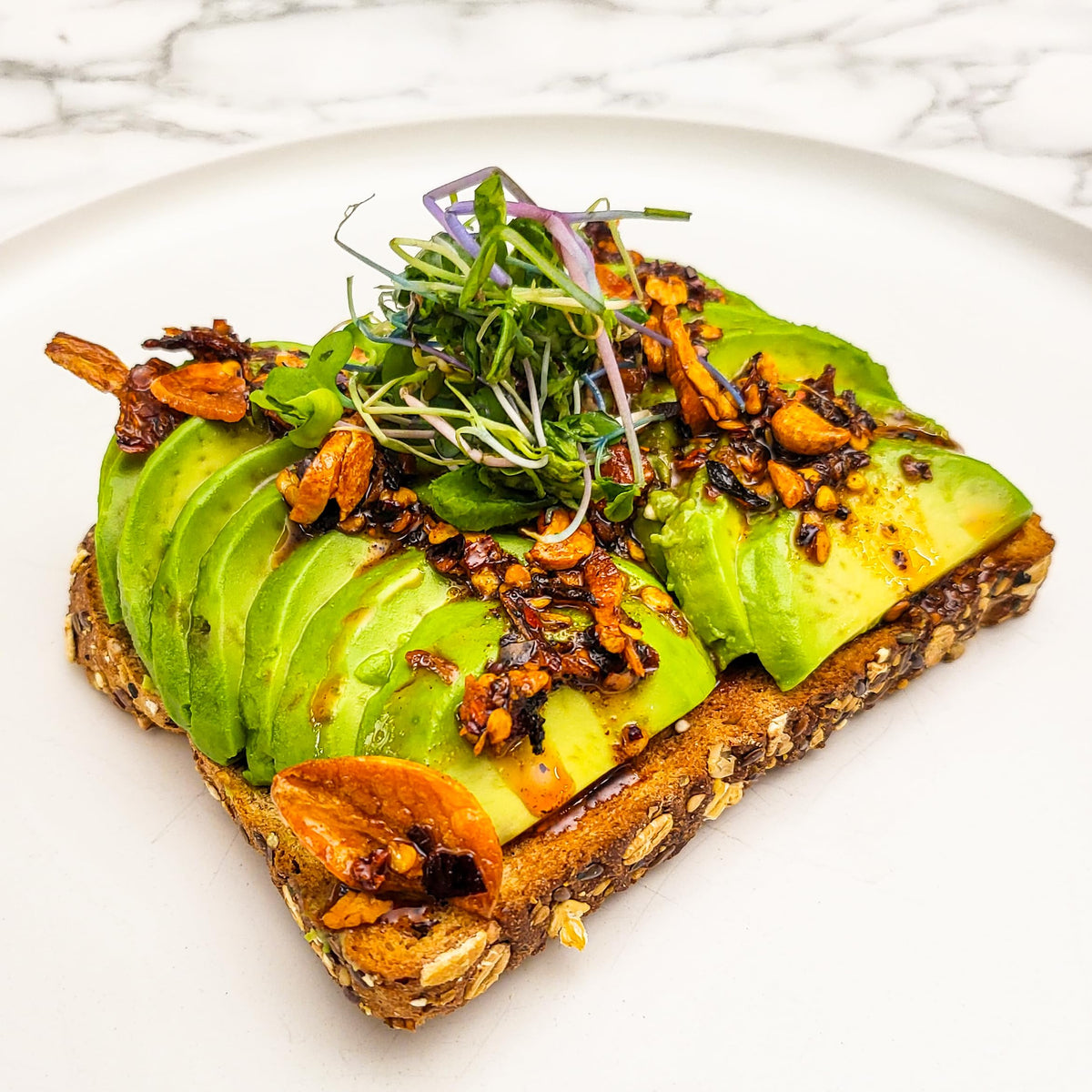 Hot Crispy Oil drizzle over eggs suggests elevated breakfast with crisp texture
