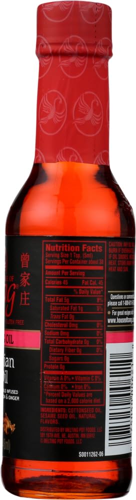Pouring House of Tsang Mongolian Fire oil for massage.