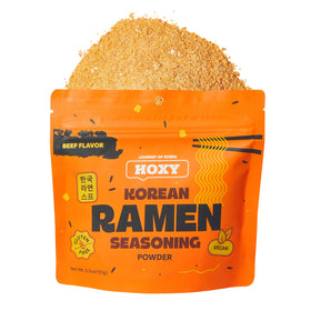 HOXY beef ramen seasoning bottle close-up with rich savory aroma.