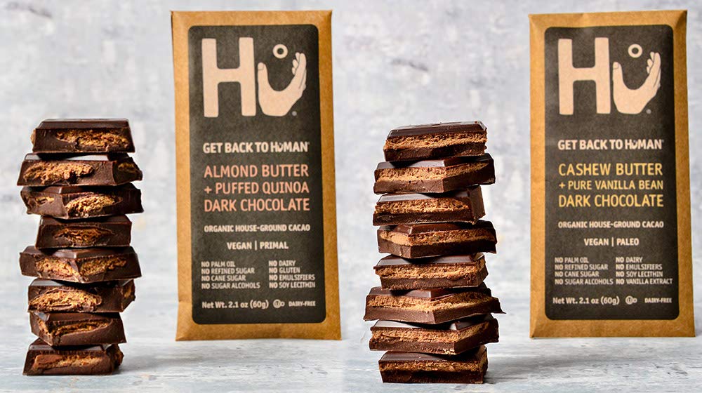 Hu dark chocolate closeup, rich flavor aroma with almond butter for energy.
