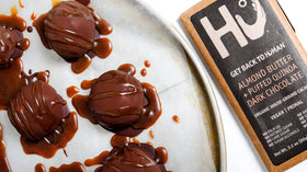 Hu snack plate with bar, perfect on-the-go energy.