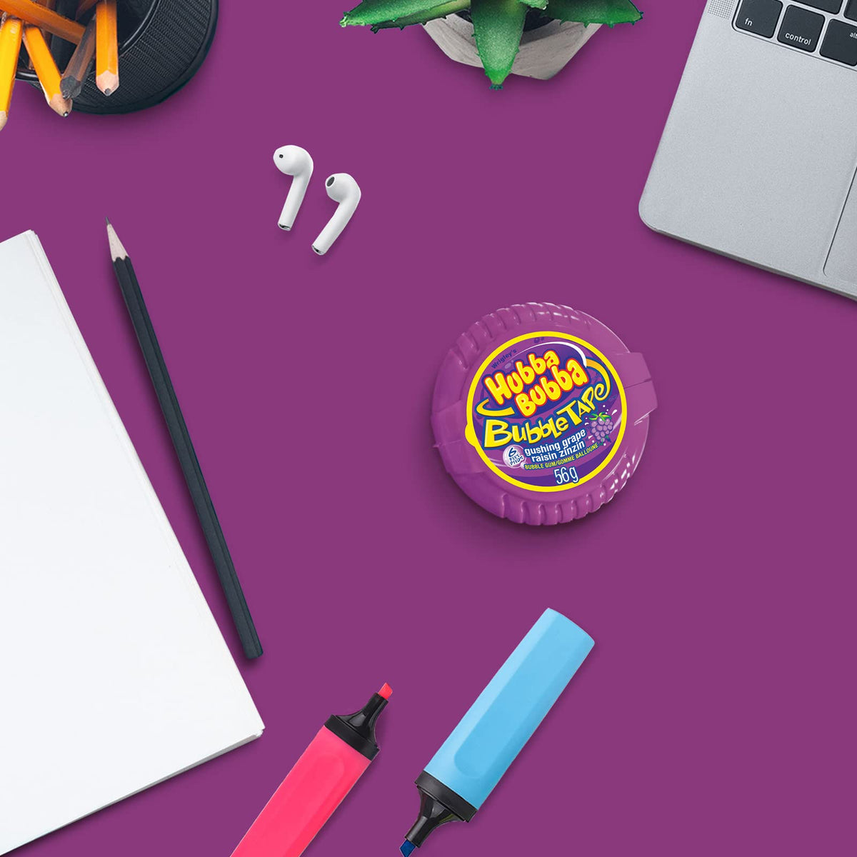 Hubba Bubba Bubble Tape box with twelve rolls on shelf for family use.