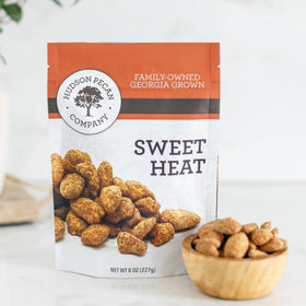 Hudson Pecan Company Sweet Heat bag closeup, a tasty, convenient snack for busy days.