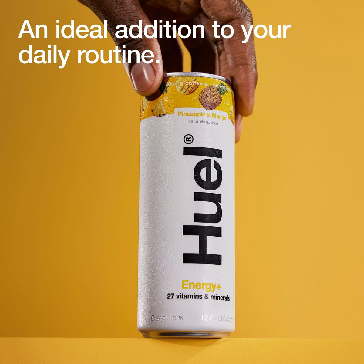 Huel Energy+ pour shows a vibrant tropical beverage in a glass.