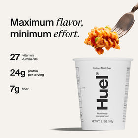 Huel Hot and Savory Bolognese cup with steam rising, a quick balanced meal.