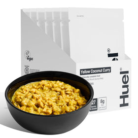 Huel Hot Savory Yellow Coconut Curry pack ready to heat for a protein-packed plant-based meal.