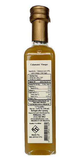 Huilerie Beaujolaise Calamansi Vinegar being poured, ideal for dressings and sauces.