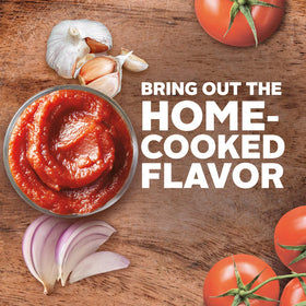 Hunt's Tomato Sauce canning process close-up conveys robust flavor.