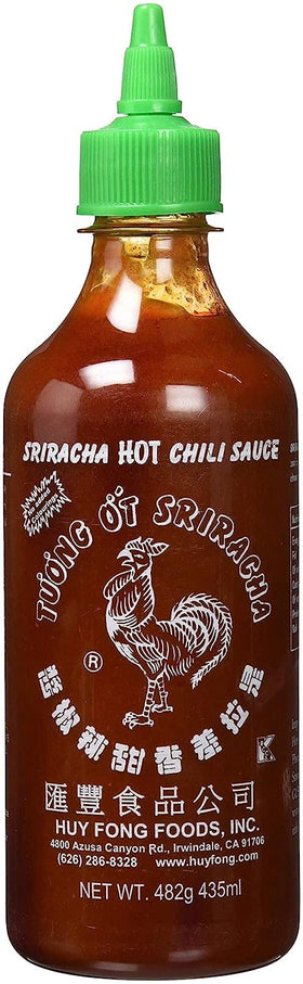 Huy Fong Sriracha bottle front view, adds bold chili heat to soups, noodles, and grilled dishes.