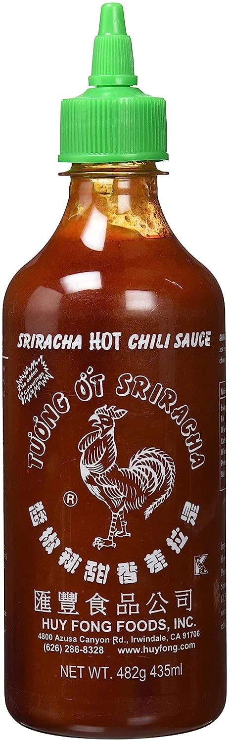 Huy Fong Sriracha bottle front view, adds bold chili heat to soups, noodles, and grilled dishes.
