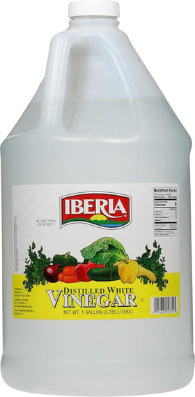 Iberia all natural distilled white vinegar poured from a 1-gallon bottle for cooking
