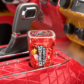 Ice Breakers Fruit Punch bottle in car cup holder ready