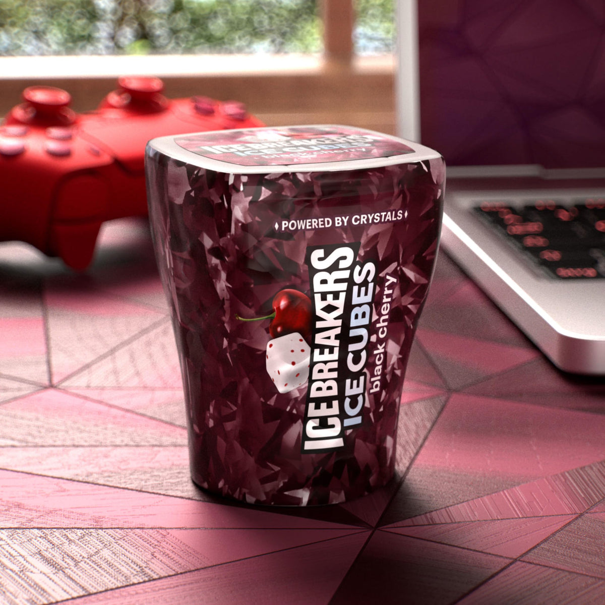 Ice Breakers Ice Cubes Black Cherry on a desk with other essentials
