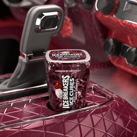 Ice Breakers Ice Cubes Black Cherry bottle tucked in a backpack