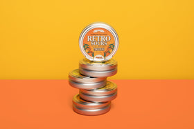 Iconic Candy Retro Sours packaging highlights collectible tins for giftable treats.