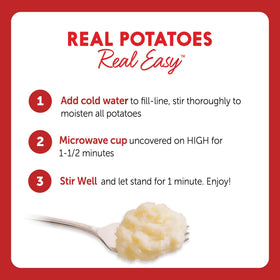 Creamy Idahoan mashed potatoes in a serving bowl beside a plate.