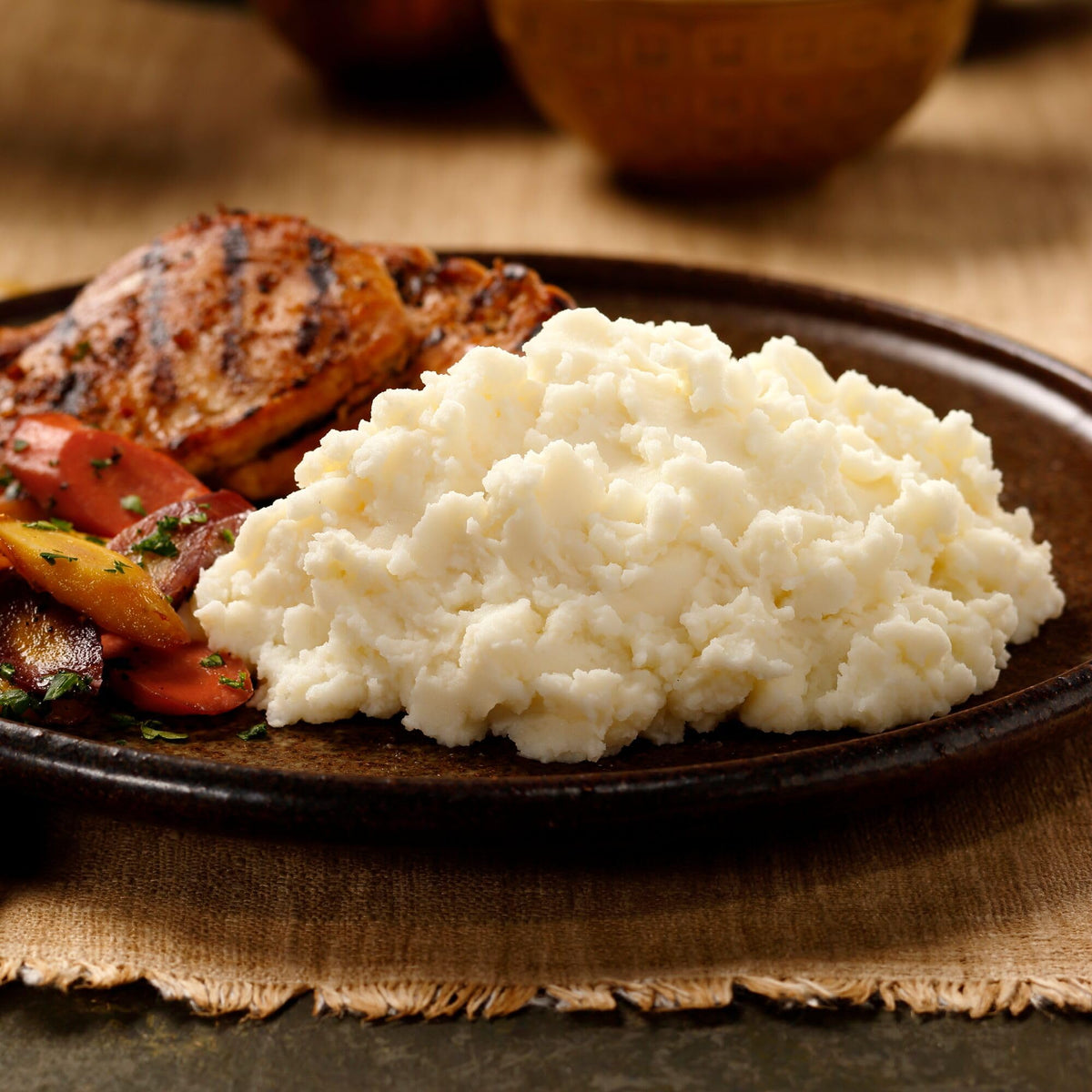 Idahoan Buttery Homestyle Mashed Potatoes served on a plate with steam