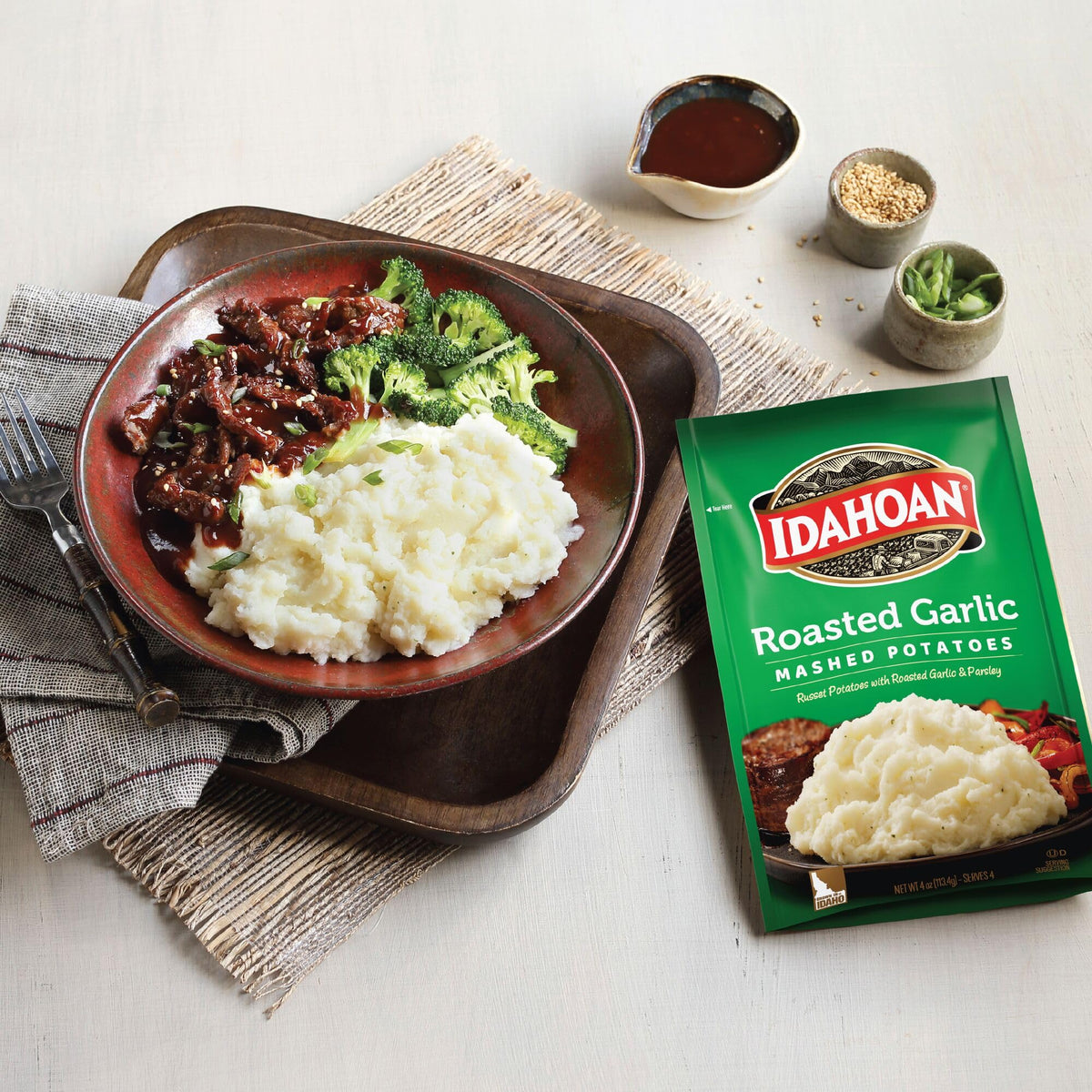 Idahoan Roasted Garlic Mashed Potatoes pack of 12 pouches on shelf