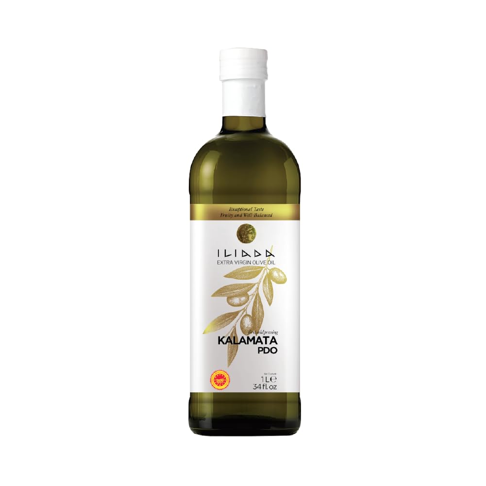 Iliada Kalamata PDO olive oil bottle on kitchen counter, ideal for finishing dishes with fresh flavor.