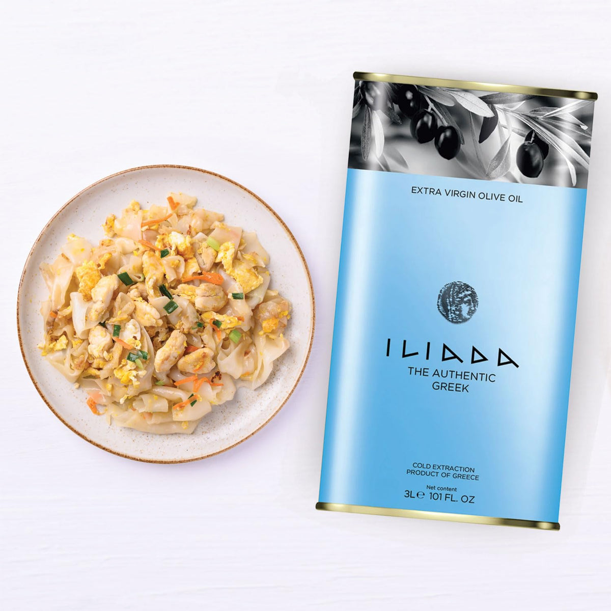 ILIADA Koroneiki olive oil drizzled over salad for vibrant taste.