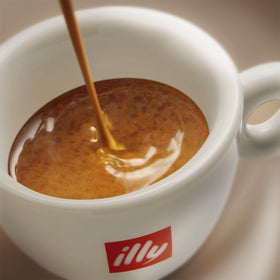illy Ground Espresso Intenso Dark Roast six-pack on display for home use