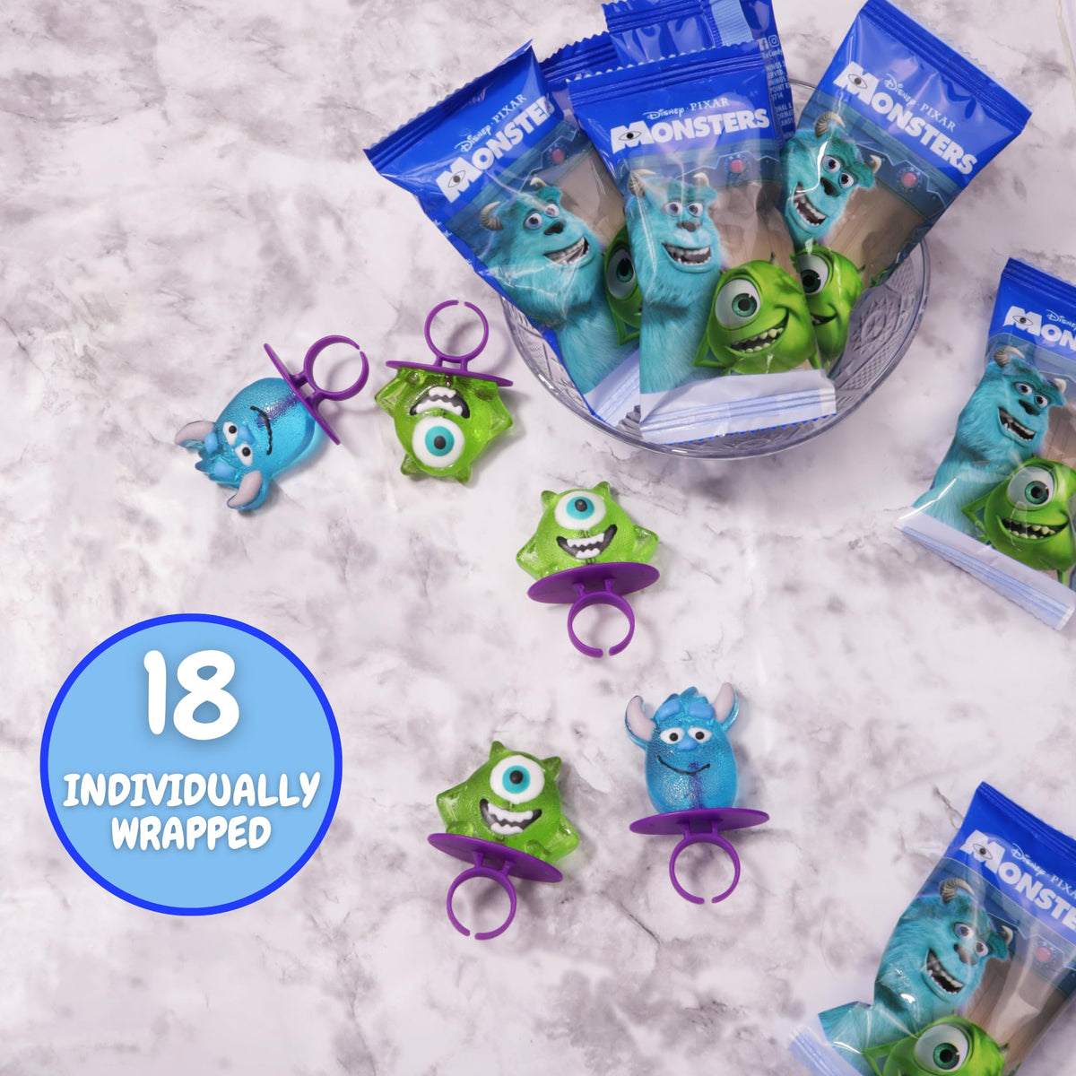 Party table display featuring Sully and Mike lollipops for themed events