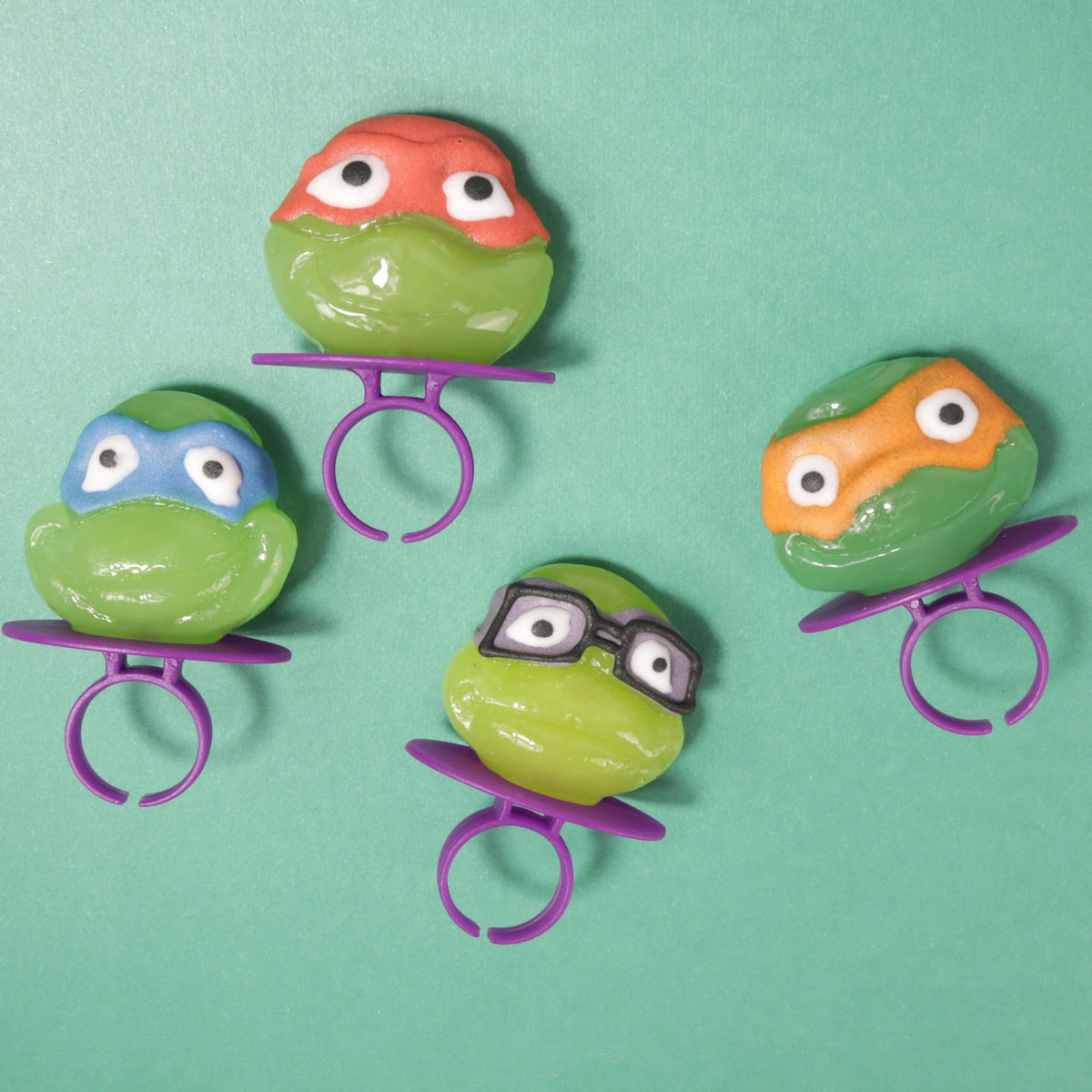 Imaginings 3 TMNT Michelangelo lollipop ring with face for celebrations.