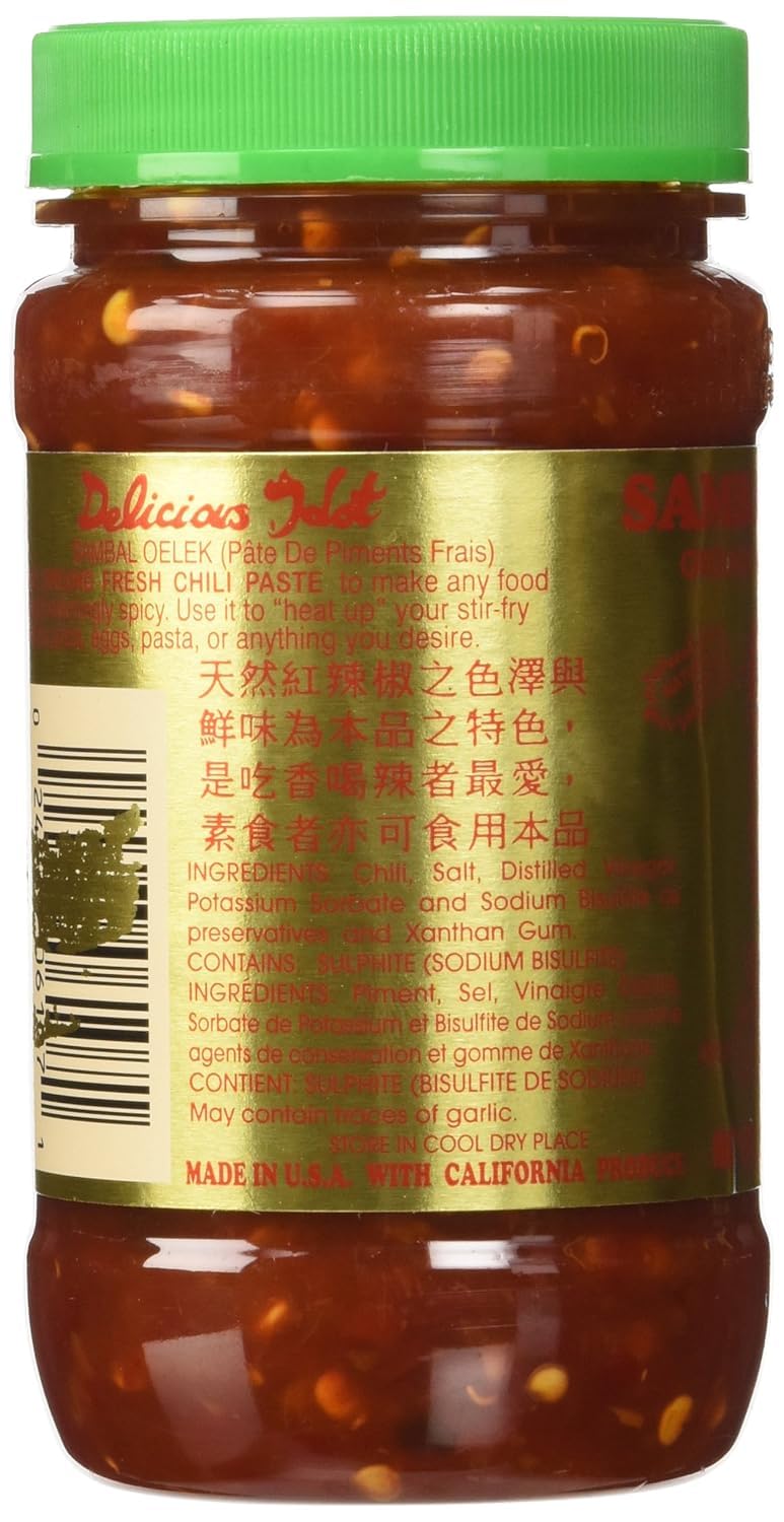 Spoon lifting iMoZai Sambal Oelek reveals smooth paste and spicy aroma.