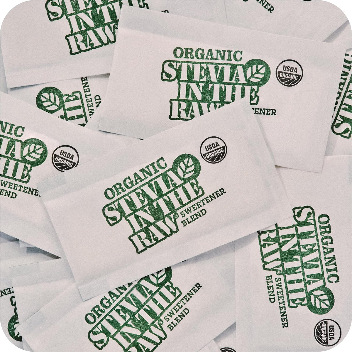 In The Raw stevia packets beside a coffee cup for hot beverages