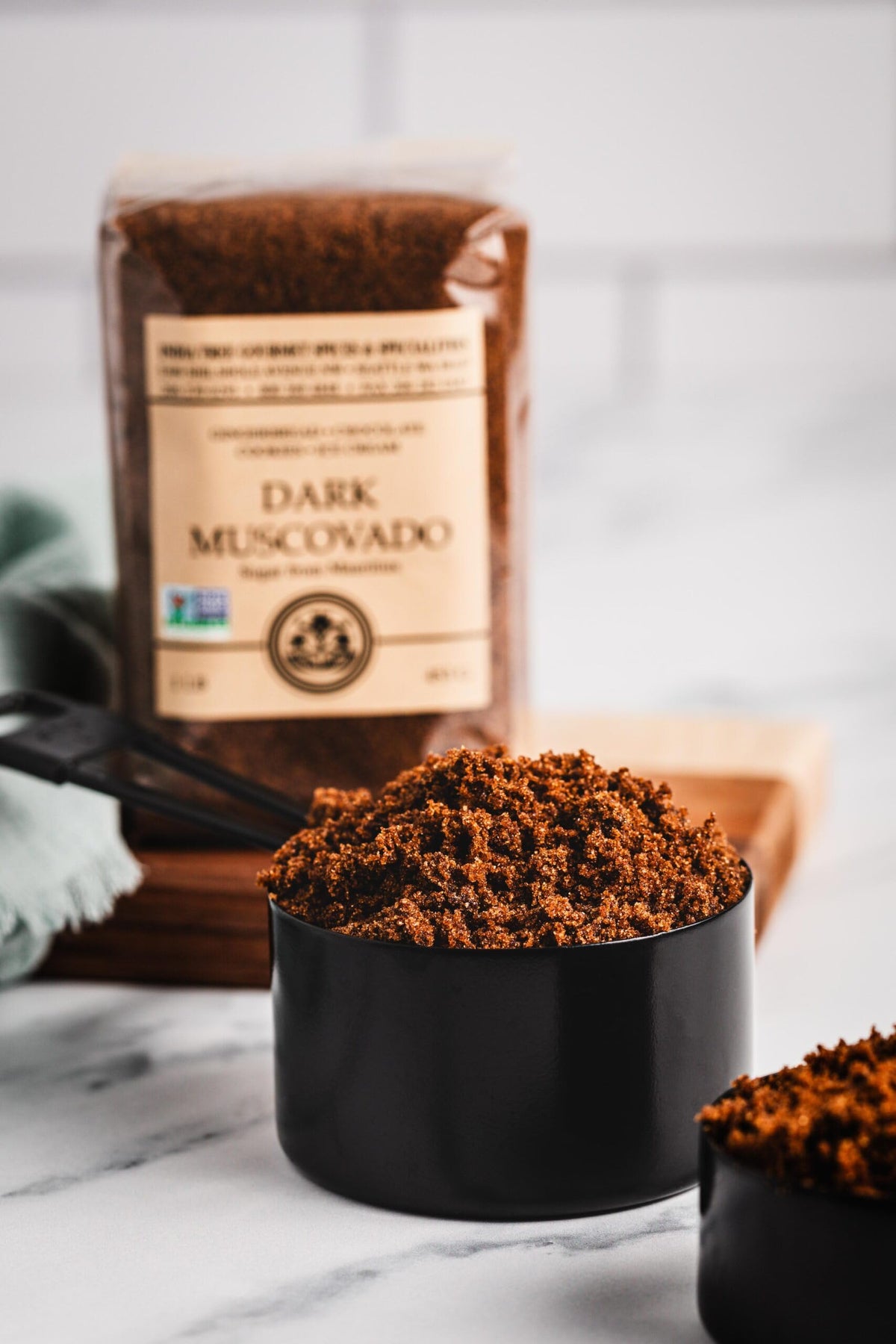 Baking scene featuring India Tree Dark Muscovado Sugar for gingerbread and fudge.