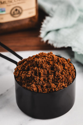 Jar of India Tree Dark Muscovado Sugar with label, premium quality for desserts.