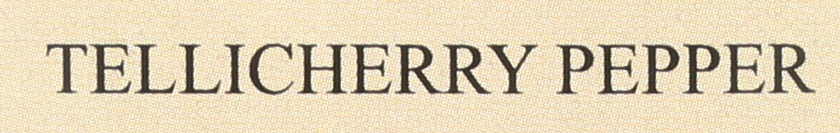 Tellicherry pepper sprinkled over salad dressing for brightness