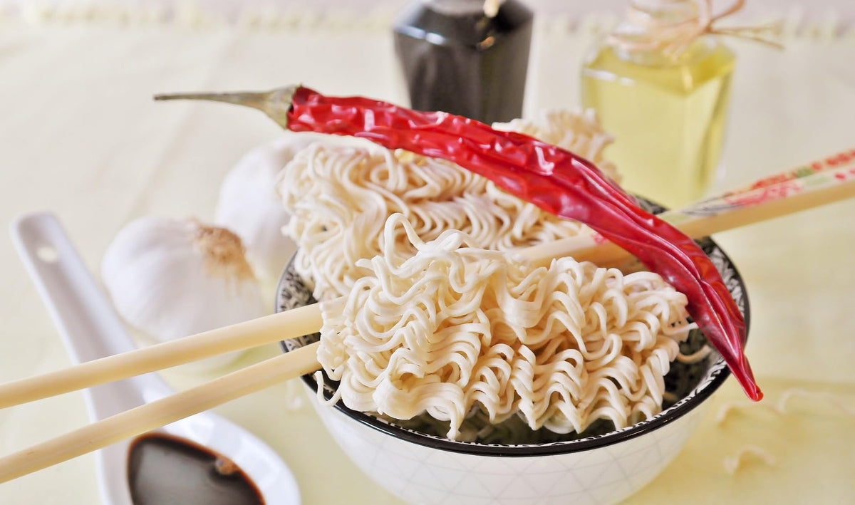 Indomie Chicken Curry cooked noodles in a ready-to-eat bowl.