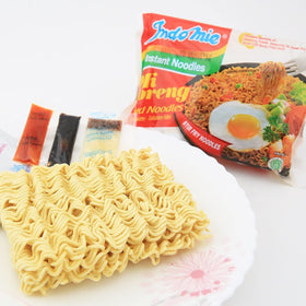 Indomie Mi Goreng finished dish served in a vibrant bowl for sharing.