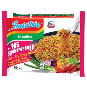 Indomie Mi Goreng noodles closeup, ready for sizzling stir-fry with bold heat.