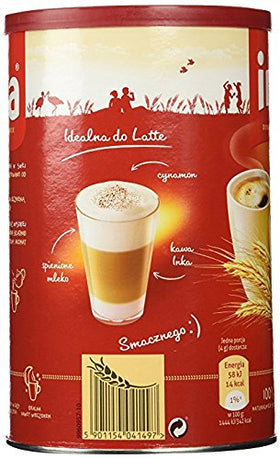 Milk froth rising beside the can, suggesting creamy coffee options.