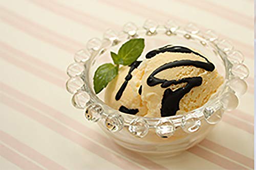 IPPINKA Japanese Black Sesame Paste pouring into bowl, ideal for dressings and toppings.