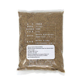 Close-up of Kokuto granules reveals rich texture and depth.