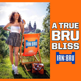 IRN-BRU Original carbonation bubbles shimmer in glassware for crisp taste.