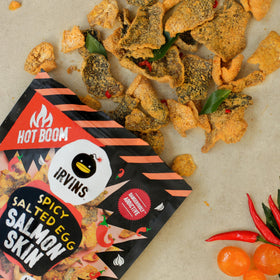 IRVINS hand cooked salmon skin crisps highlighting premium texture.